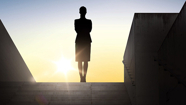 Silhouette of woman standing in stadium